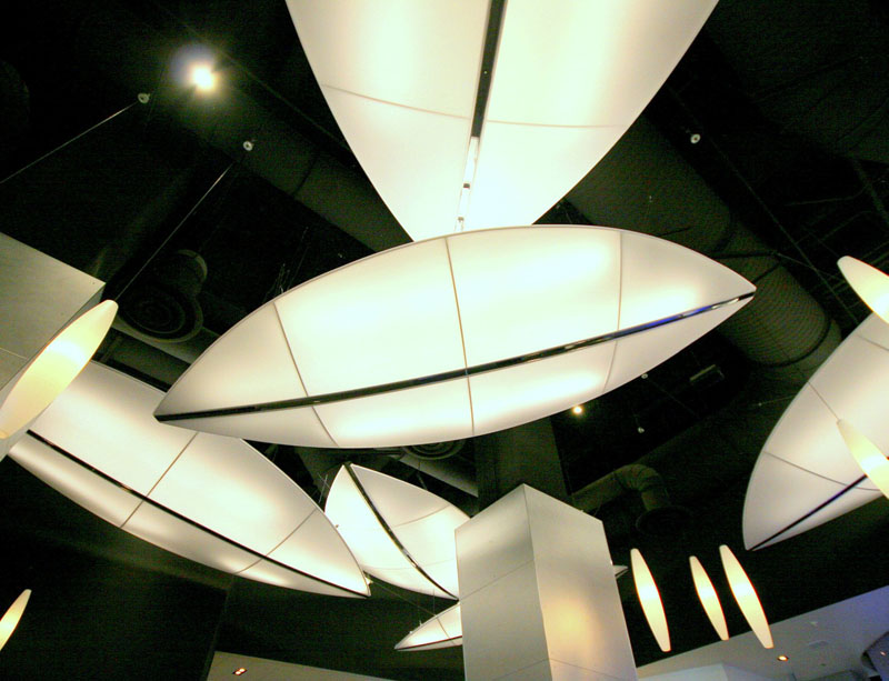 The architect designed two types of of large, sculptural lighting elements, using fabric as the light diffuser.