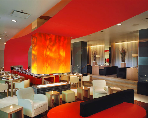 The Wave Restaurant design by Studio GAIA, features a giant red fabric wave to create the theme.