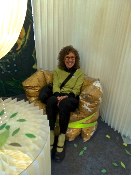 Cindy sitting in a chair made from collected scraps of paper instead of the polystyrene beads of a beanbag chair- much more eco-conscious. http://www.chenel.com
